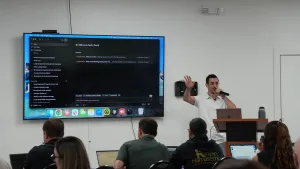 David teaching a Claude class in front of a large screen