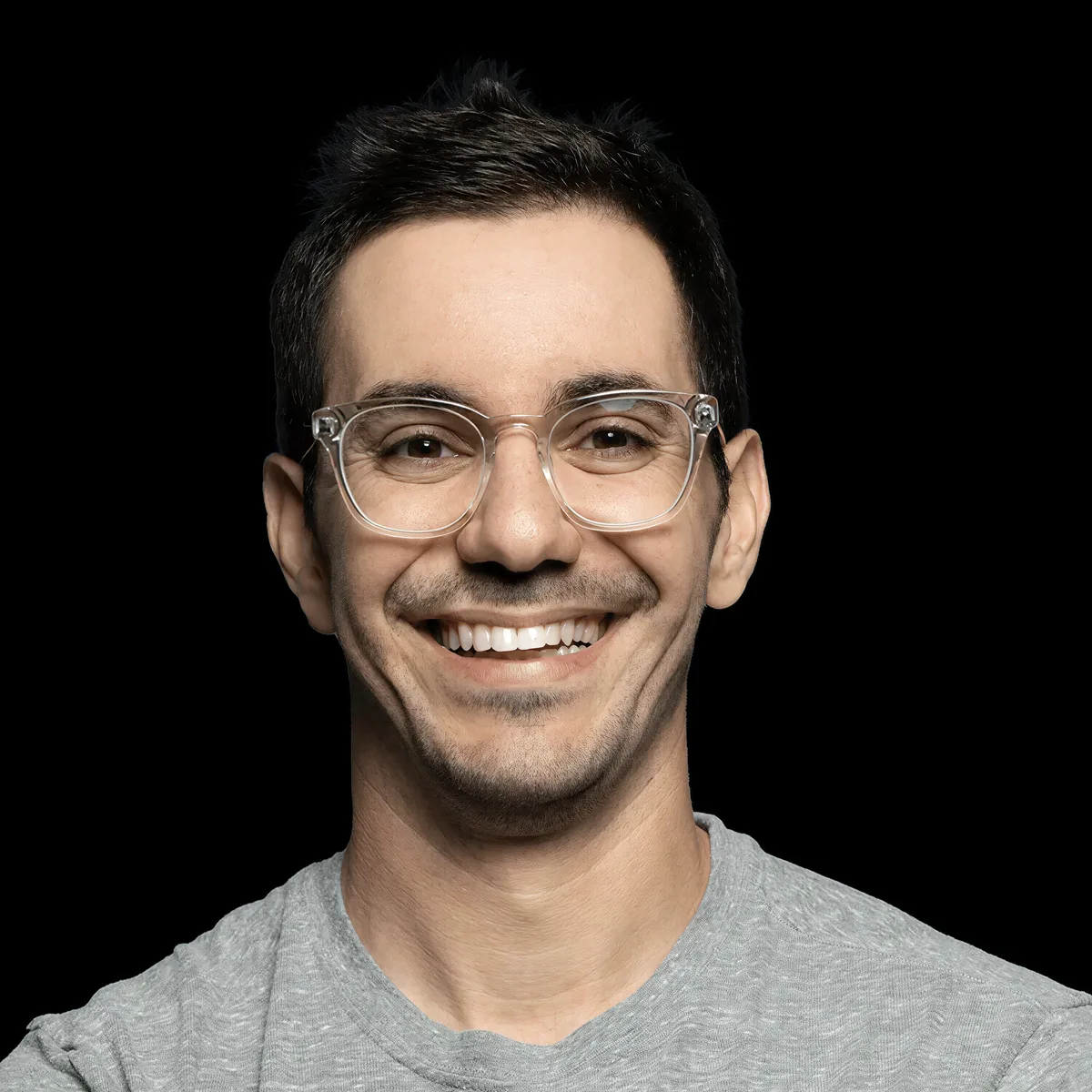 David Bitton headshot, arms crossed, grey shirt