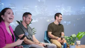 David laughing on the same panel, mic in hand