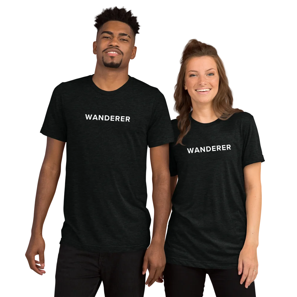 Two people wearing black Wanderer t-shirts with white text